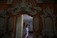 A church gong ensemble prepares for choir hymns during the Christmas mass in an old Catholic church, Tritunggal Mahakudus Tuka, in Dalung village, North Kuta, Badung, Bali, on Christmas day. JP/Ni Luh De Suryani

 