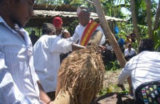 Lower is better: Paddy is lowered by Ndolu elders for community ritual purposes. JP/Markus Makur