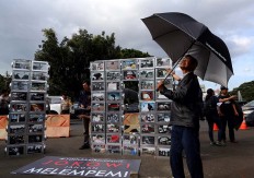 Activists participate in the 10th anniversary commemoration of the Kamisan silent protest in front of the Presidential Palace in Jakarta on Jan. 19. The 477th Kamisan marks the 10th year since the first protest in 2007 asking the government to resolve past human rights violations. JP/Seto Wardhana.
