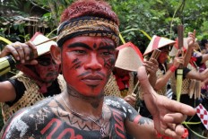 A Reog Abang dancer from Jatisrono, Wonogiri, Central Java, performs during the ceremony of the Kebo Ketan slaughter in Ngawi, East Java. JP/Magnus Hendratmo