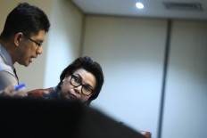 KPK deputy chairperson Basaria Panjaitan (right) and La Ode Muhammad Syarif make a press statement that Constitutional Court justice Patrialis Akbar allegedly accepted bribes from a beef importing company at the Corruption Eradication Commission office in Jakarta on Thursday January 26. JP/ Dhoni Setiawan