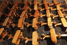 Airplane miniatures are arranged neatly, ready to be packaged and sold. JP/ Ganug Nugroho Adi