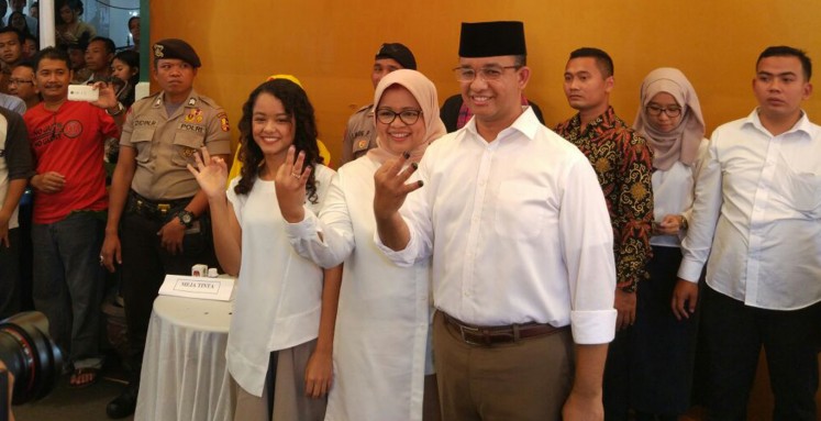 Anies and family cast votes in Lebak Bulus