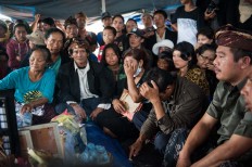 People mourn the loss of a person killed in a landslide in Songan village on Monday, February 13, 2017. JP/ Anggara Mahendra