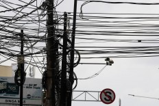 Cable craze: Disorganized cable arrangements affect the capital's landscape and views. JP/ Dhoni Setiawan