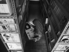 A woman looks at vinyl records by Indonesian musicians such as Waljinah that are stored on the shelves. JP/Ganug Nugroho Adi