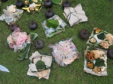 Villagers prepare cone-shaped rice and traditional snacks before the parade kicks off.  JP/Ganug Nugroho Adi

