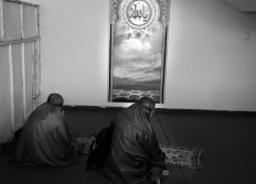  Two players pray in between matches during the 2017 Pro Liga in Ken Arok Indoor Stadium in Malang, East Java, on March 18. JP/Aman Rochman