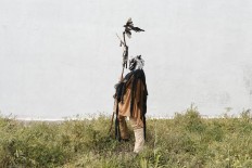 In this April 1, 2017 picture a man dressed as a 'Harramacho' a traditional character from the Navalacruz carnival pauses during a traditional Spanish mask gathering parade in the small village of Casavieja, Spain, Monday, April 3, 2017. These festivals, held across central and northwestern Spain, most often coincide with festivities celebrating the advent of spring, mixing Carnival and bizarre pagan-like rituals with mock battles between good and evil. AP /Daniel Ochoa de Olza