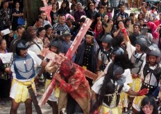 An actor from Ngolodono Church in Karangdowo, Klaten, Central Java, performs the Procession to Calvary, which shows Jesus carrying the cross to the site of his crucifixion.  JP/Ganug Nugroho Adi