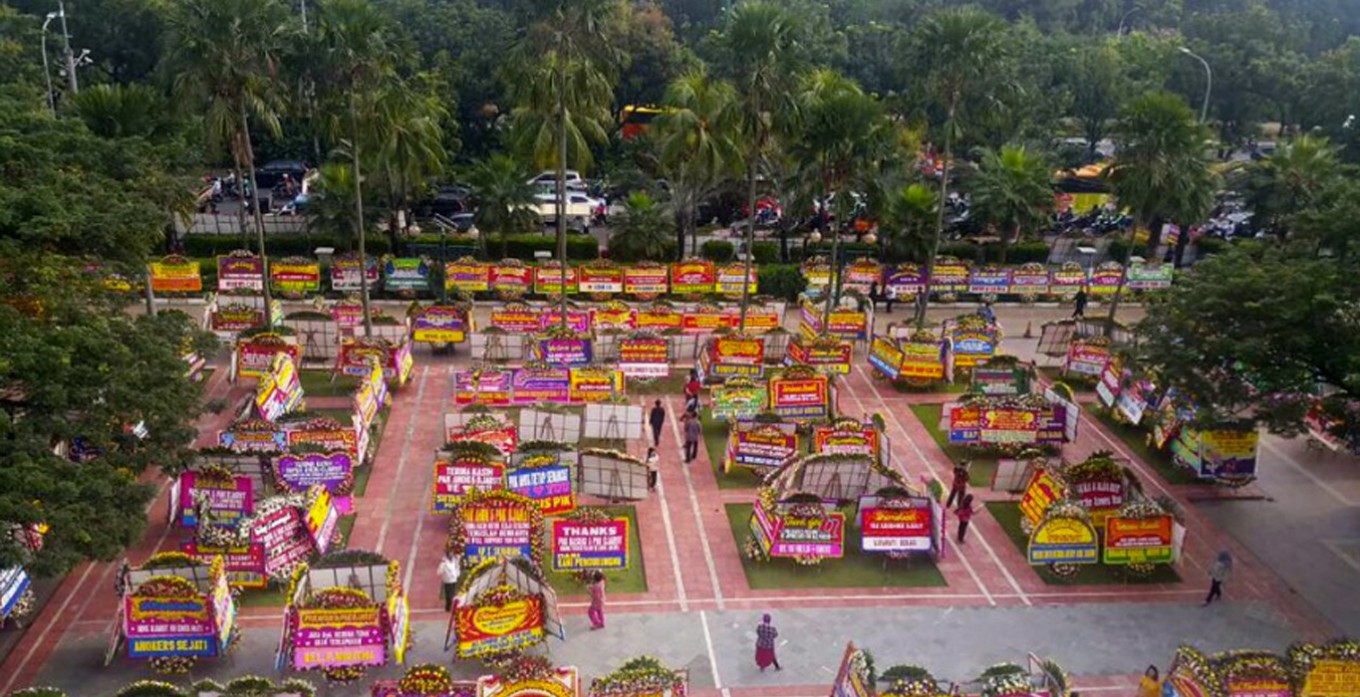 City Hall decorated with wreaths thanking Ahok
