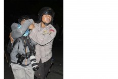 In pain: Korban Aksi Damai 4 November (Victim of Nov 4. Demonstration) by Rifqi Riyanto