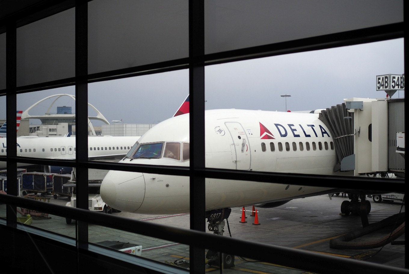 A passengers waits for a Delta Airlines flight in Terminal 5 at Los Angeles International Airport, May 4, 2017 in Los Angeles, California. In yet another incident that could prove a public relations nightmare for the airline industry, a California couple has come forward claiming they were kicked off an overbooked Delta flight for refusing to give up their child's seat. The incident unfolded last week as the Schear family of Huntington Beach were flying back home from Hawaii to Los Angeles.