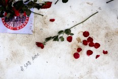 Red rose petals scattered among a handwritten #SaveAhok message and an Ahok-Djarot sticker are visible outside the Agriculture Ministry in Ragunan, South Jakarta, on May 9. The North Jakarta District Court sentenced Jakarta Governor Basuki Tjahaja Purnama (Ahok) to two years’ imprisonment for blasphemy. Ahok -- who was immediately detained at the Cipinang detention center but later moved to the Kelapa Dua Mobile Brigade detention center – has appealed the verdict. JP/Seto Wardhana.