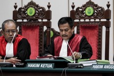 North Jakarta District Court chief judge Dwiarso Budi Santiarto reads out a guilty verdict against incumbent Jakarta Givernor Basuki "Ahok" Tjahaja Purnama and sentences him to two years' imprisonment for blasphemy. JP/Kurniawan Mas'ud/Pool
