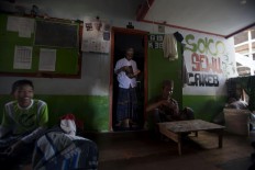 The atmosphere in front of a student’s room. Some of them rest while others prepare to recite the Quran. JP/Sigit Pamungkas