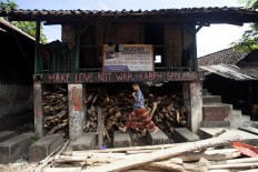 A santri walks in front of a langgar (small mosque). JP/Sigit Pamungkas