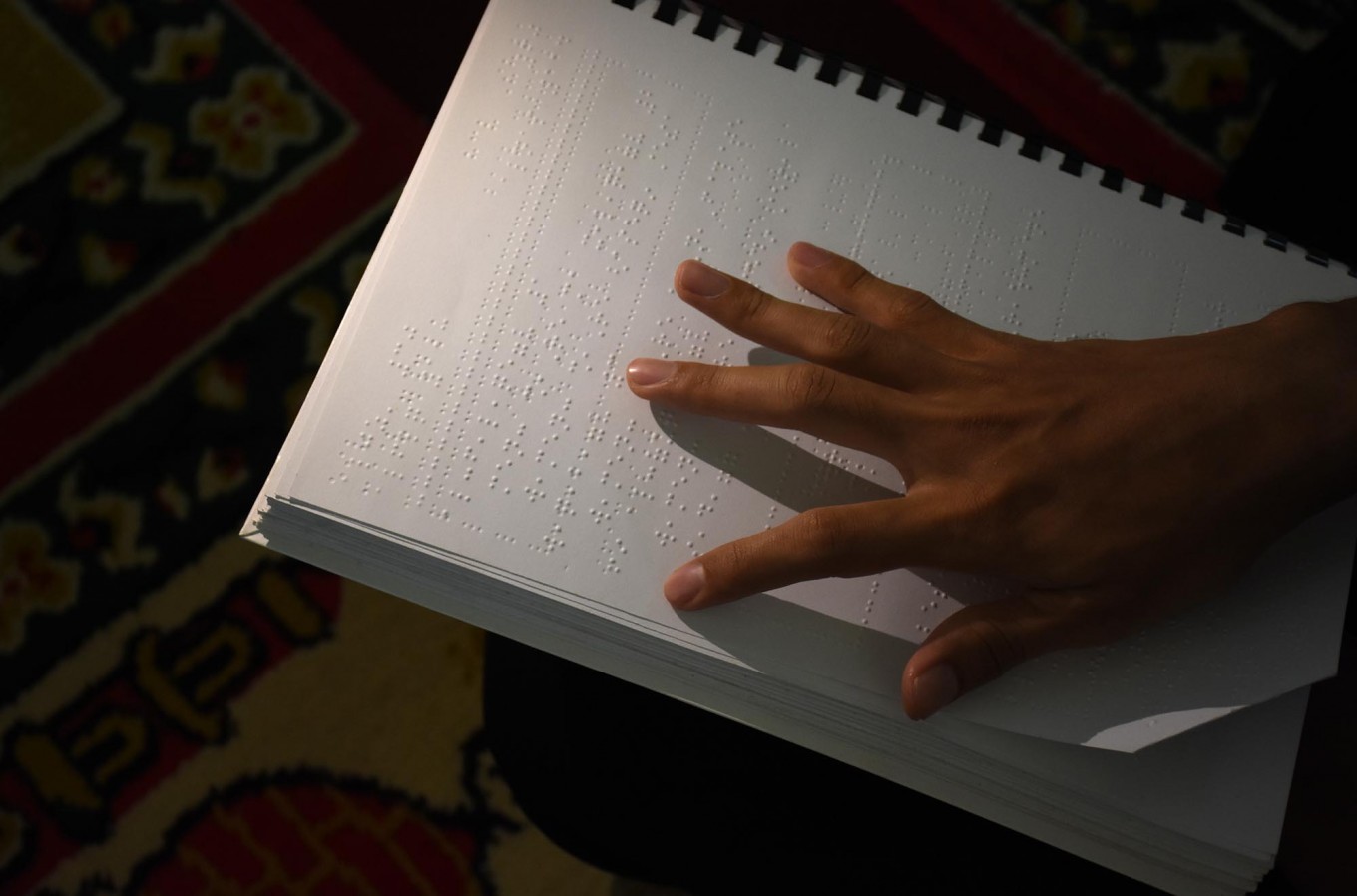 Guiding the blind with braille Quran