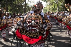 Balinese artists perform the Okokan dance during the opening of the 39th Bali Art Festival at the Bajra Sandhi Monument in Denpasar. JP/Agung Parameswara