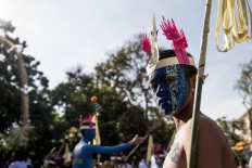 A young Balinese man takes part in the opening of the 39th Bali Art Festival at the Bajra Sandhi Monument in Denpasar. JP/Agung Parameswara
