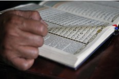 A student recites verse Al Hud 71-88 of the Quran. JP/Magnus Hendratmo