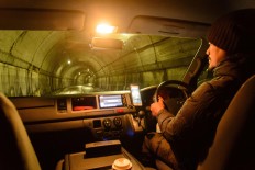 Rustono drives his car in the middle of the night during winter to check the tempeh fermentation process. JP/Tarko Sudiarno