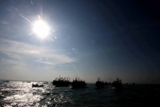 A convoy of boats during the Lomban Festival in Jepara Bay, Central Java, on July 2. JP/Maksum Nur Fauzan