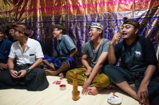 Villagers tease Novi, who was married the day before, by asking intimate questions about her love life. JP/Anggara Mahendra