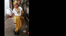 Nustain, 48, from Jakarta, poses with friends before the festival begins. JP/Aman Rochman