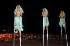Three students from the SMAN 2 high school in Komba, East Manggarai, perform the Wai Doka dance during a welcoming ceremony for cyclists at Muara Borong beach. JP/Markus Makur