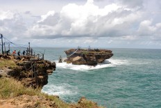 The view of Timang islet in Gunung Kidul regency, Yogyakarta. Tourists must brace themselves to cross the strait. JP/Magnus Hendratmo