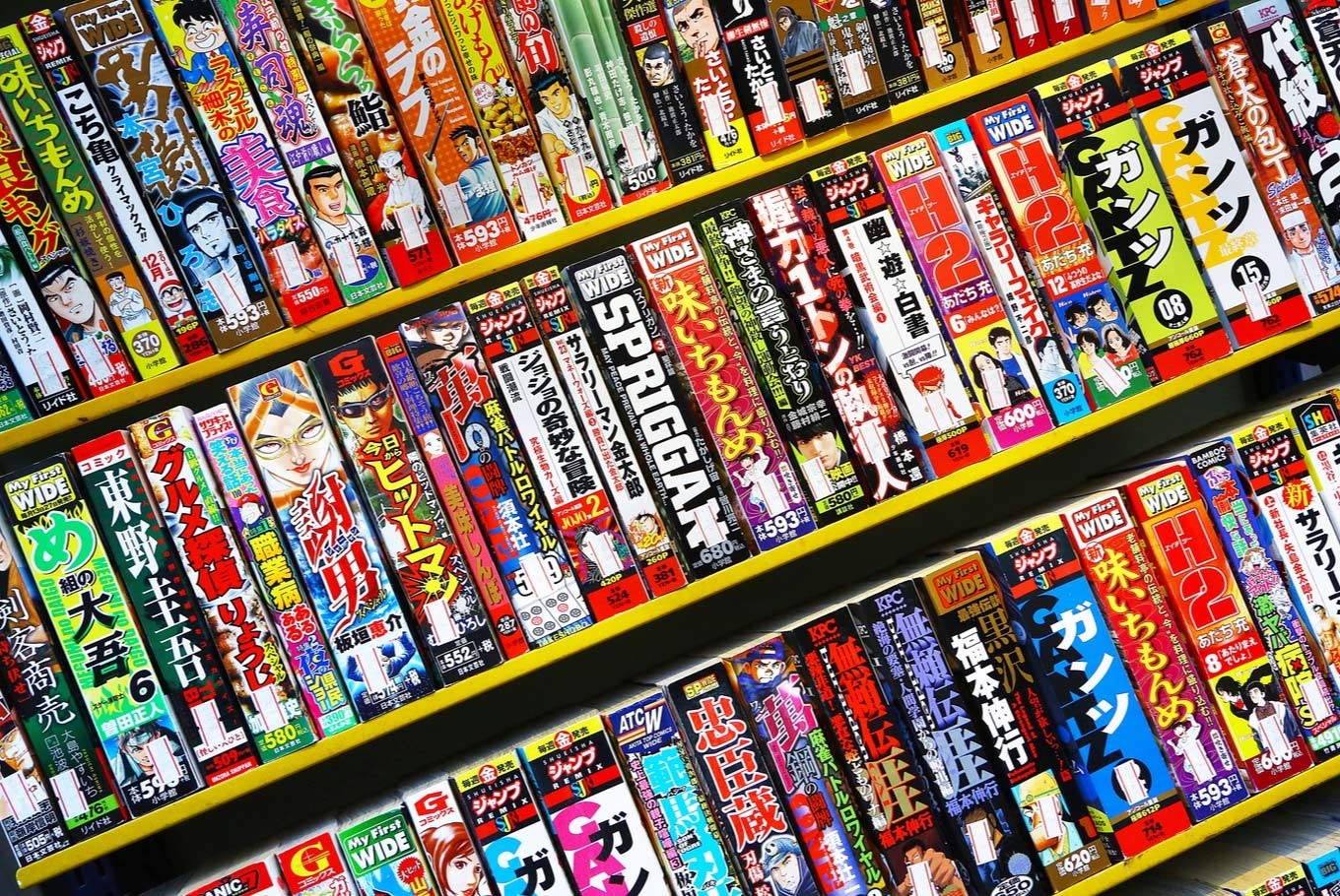 Rows of Japanese comic book or manga on display in a bookstore.
