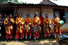 Musicians for the Reog (A traditional dance originated from Ponorogo, East Java, that features a lion figure) performance are waiting for their turn. JP/Stefanus Ajie