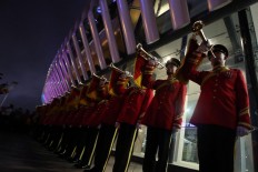 Trumpet squad plays its instruments as Sultan Muhammad V leaves the stadium after the opening of the SEA Games. JP/Seto Wardhana