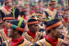 Saman dancers sit while waiting to perform the traditional dance. JP/Hotli Simanjuntak