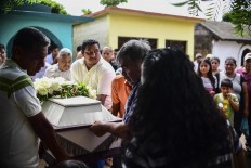 Relatives and friends accompany to the cemetery the remains of a victim of Thursday night's 8.2 magnitude quake, in Juchitan, Oaxaca, Mexico, on September 10, 2017. Rescuers pulled bodies from the rubble and grieving families carried coffins through the streets Saturday after Mexico's biggest earthquake in a century killed 65 people. AFP/ Ronaldo Schemidt