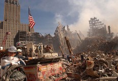In this photo obtained 18 September 2001 from the Federal Emergency Management Agency (FEMA), firefighters and Urban Search and Rescue workers battle smoldering fires as they search for survivors at the ruins of the World Trade Center in New York 13 September 2001.  Rescue and recovery work continues at the site of the devastation in downtown Manhattan but hopes of finding anyone alive in the ruins of the World Trade Center have almost faded, New York Mayor Rudolph Giuliani said 18 September, one week after the terrorist attack that toppled the twin towers.  AFP/ FEMA/ Andrea Booher