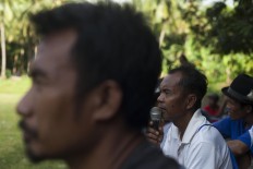 A man shouts instruction through a microphone at the event. JP/Sigit Pamungkas