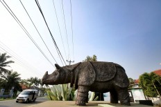 Immortalized: A Javan rhino statue stands tall in front of the Ujung Kulon National Park in Pandeglang, Banten. JP/Dhoni Setiawan