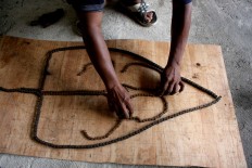 Agung assembles the basic design of Gunungan (shadow puppet conical), which symbolizes human life. JP/Maksum Nur Fauzan