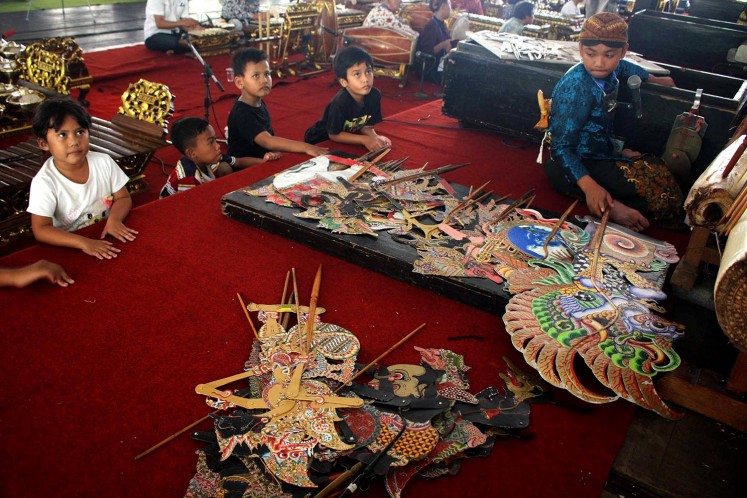 Next generation of wayang puppet masters.