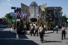 The police patrol around the Ground Zero Monument during the 15th anniversary of the Bali bombings in Kuta, Bali, on Oct. 12, 2017. JP/Anggara Mahendra