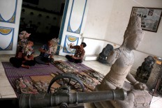 Some officials clean Dupara puppets at the museum. JP/Maksum Nur Fauzan