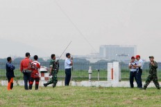 Some Air Force officers communicate with the ATC (Air Traffic Control) to assure the show is safe. JP/Arya Dipa