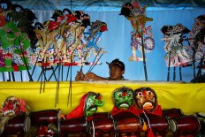 A boy performs a leather puppet performance during the 2011 festival. JP/Aman Rochman