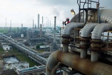 Forest of pipes: A worker monitors the plant’s activities from high ground. JP/ Jerry Adiguna
