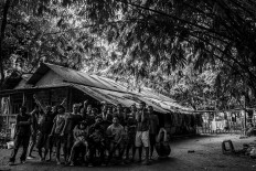 One family: Trisna Santi (front row, left) and Imanuel Talan (front row, second left) and Ady Senge (front row, third left) pose for a group photo with the residents of Rumah Peduli Sahabat Kasih in Cisauk, Banten. JP/Seto Wardhana