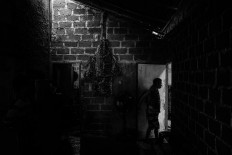 Sanctuary: A resident enters his room. JP/Seto Wardhana