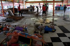 Parts of the carousel seen spread out on the ground after workers dismantled the ride. JP/Maksum Nur Fauzan
