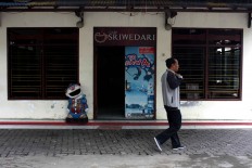A man walks past an empty Sriwedari cafe on May 12, 2017. JP/Maksum Nur Fauzan